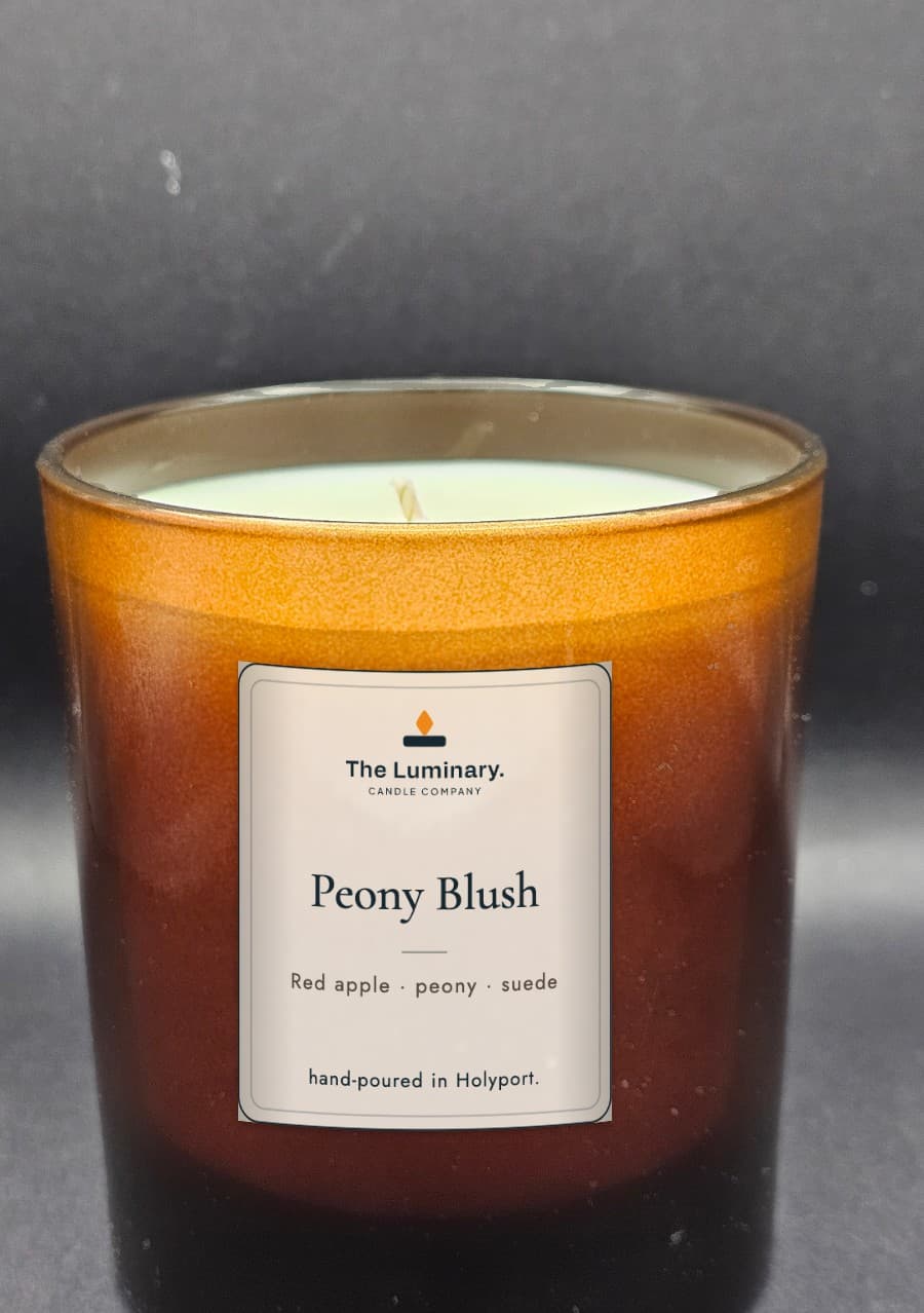 The Luminary — Peony Blush candle in a 30cl amber glass jar